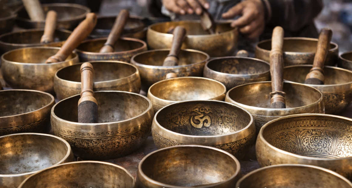 Handcrafted Nepalese singing bowls made by artisans, displayed for export sourcing and global wellness markets”