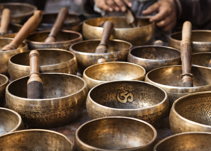 Handcrafted Nepalese singing bowls made by artisans, displayed for export sourcing and global wellness markets”