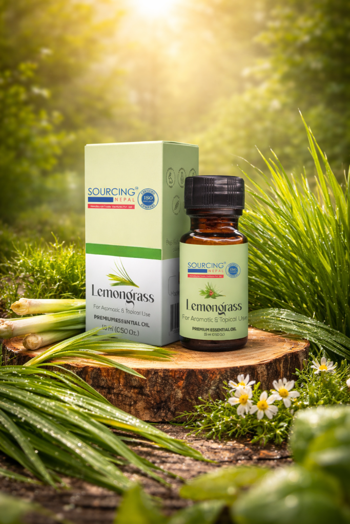 Premium lemongrass essential oil by Sourcing Nepal displayed on a wooden base with fresh lemongrass in a natural green outdoor setting